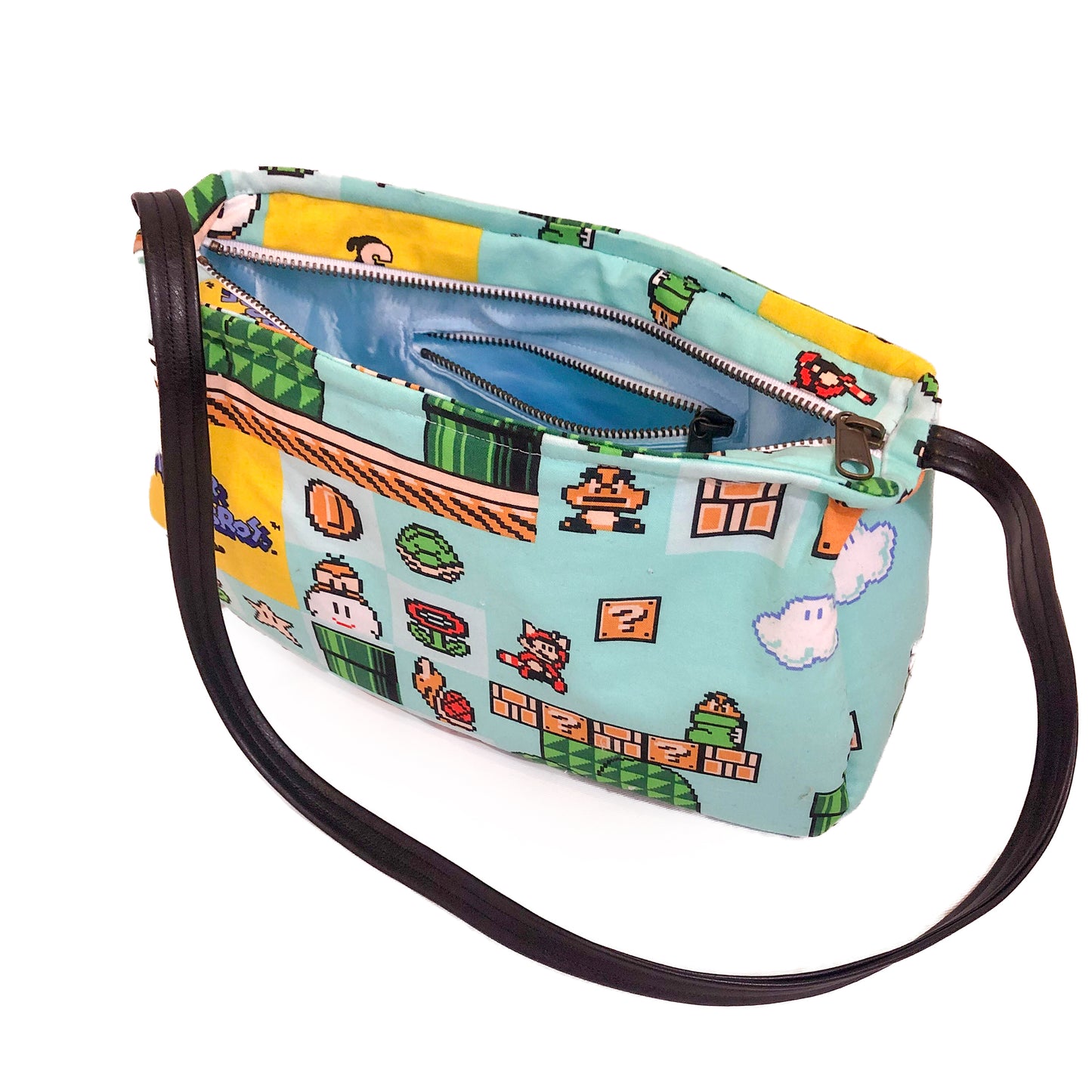 Front view of a fabric purse with a Super Mario Bros 3 motif showing the interior satin fabric