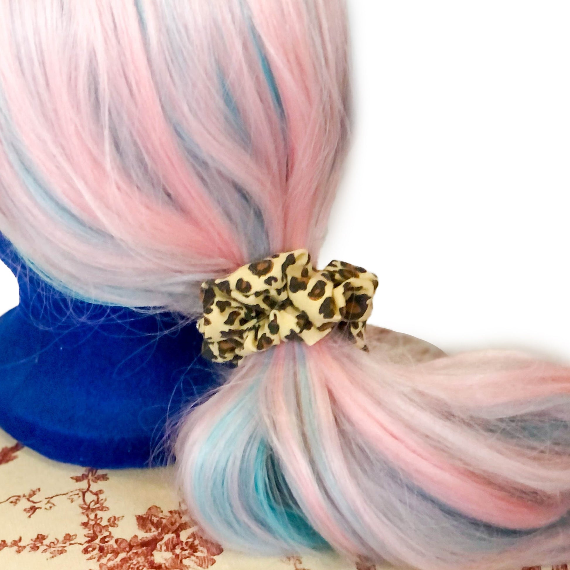 Photo of a leopard print scrunchie on a wig