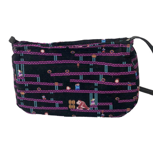 Front view of a fabric purse with a Donkey Kong motif