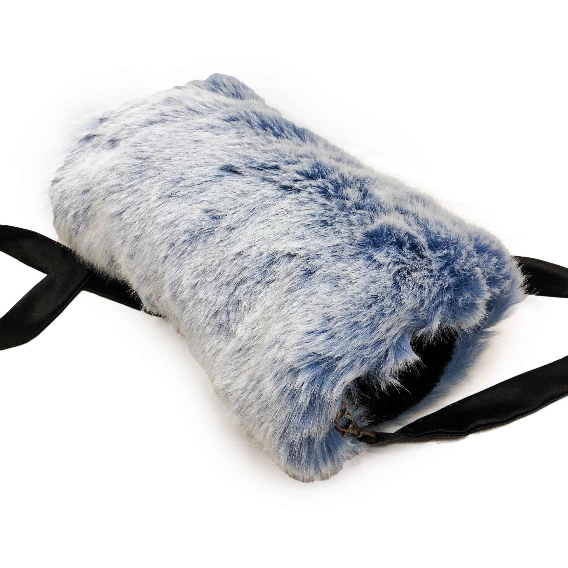 Side  view of a muff with strap made of ice blue faux fur